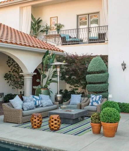 Outdoor patio area with seating and plants