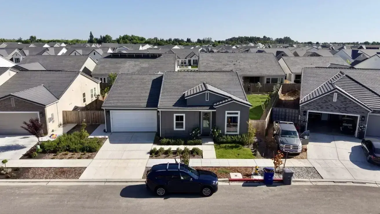 Aerial view of a suburban house and neighborhood